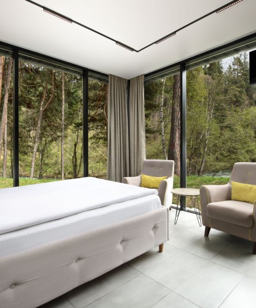 Mirrored house with panoramic windows and river view